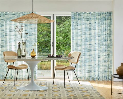 Mist aqua patterned wave curtains on patio doors in dining room