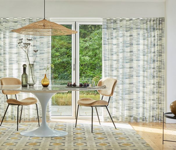 Mist slate patterned wave curtains on patio doors in dining room