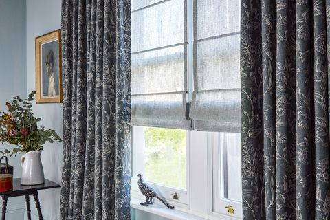Anika grey pinch pleat curtains paired with voile roman blinds
