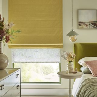 Harper sunshine roman blinds paired with daisy spring roller blinds in pastel themed bedroom