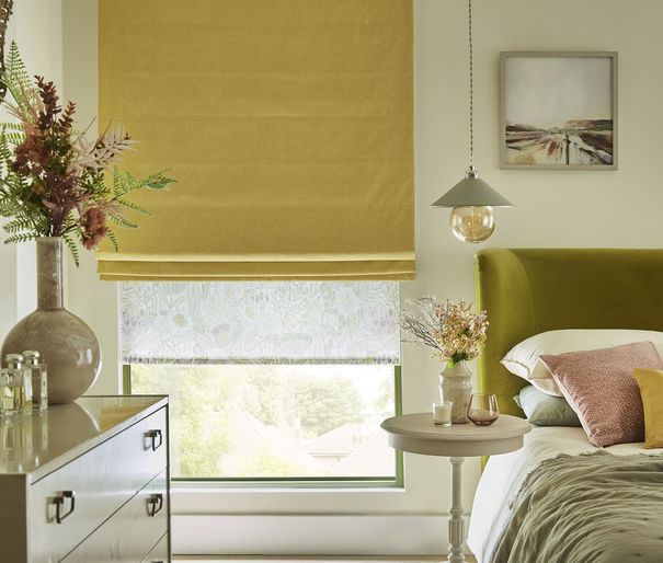 Harper sunshine roman blinds paired with daisy spring roller blinds in pastel themed bedroom