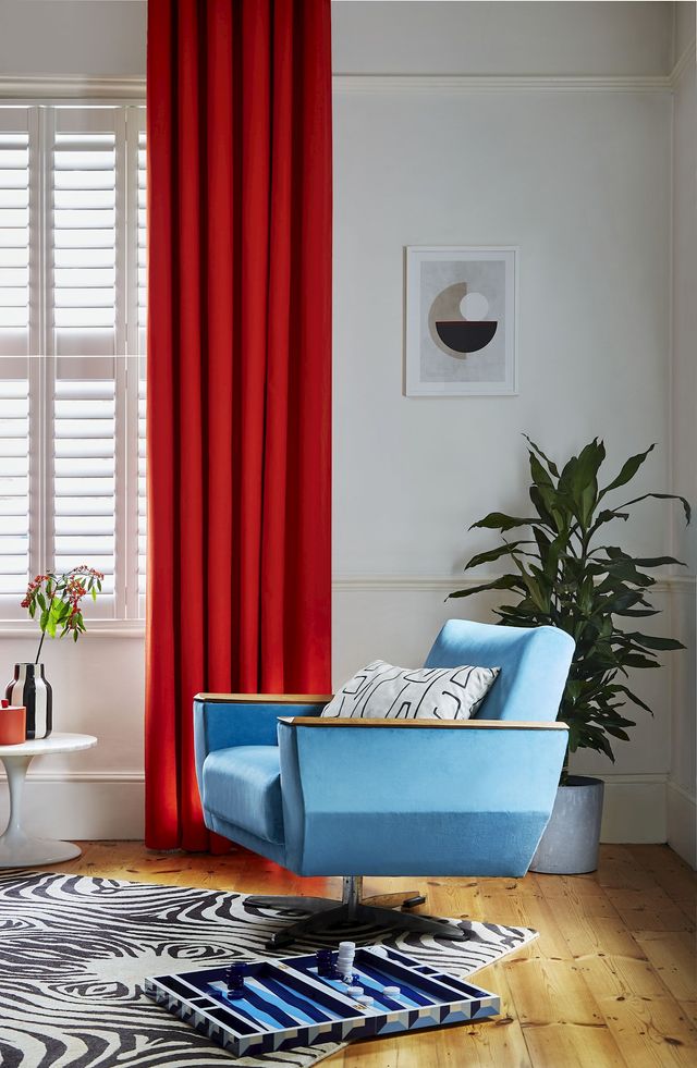 Faso fiesta floor length eyelet curtains paired with white shutters in modern living room