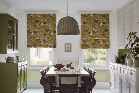 Manisha golden patterned roman blinds in light dining room