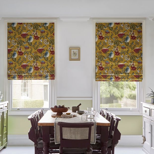 Manisha golden patterned roman blinds in light dining room