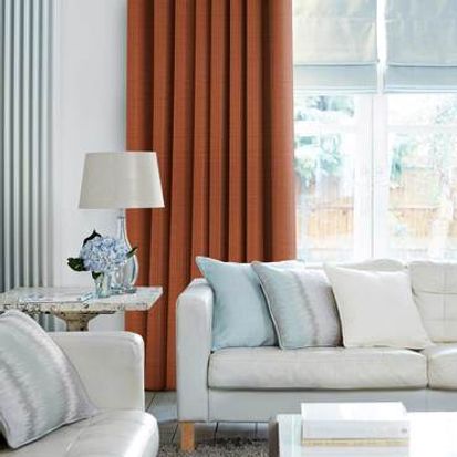 Clarence Terracotta Curtains in living room with light grey sofa