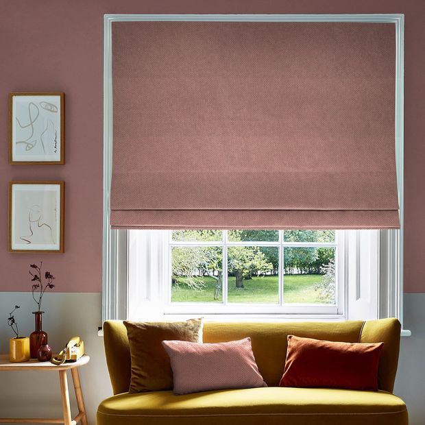 Pippa coral roman blind in bold coloured lounge