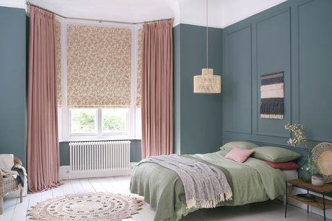 Bailey Taffy curtains paired with delizia blush roman blinds in cosy bedroom