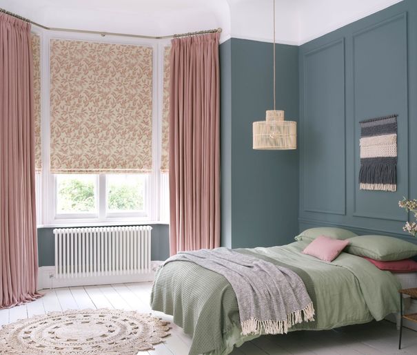 Bailey Taffy curtains paired with delizia blush roman blinds in cosy bedroom