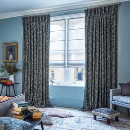 anika grey floor length curtains paired with voile roman blinds in bedroom