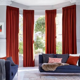 soho boucle spice floor length curtains in bay window in living room