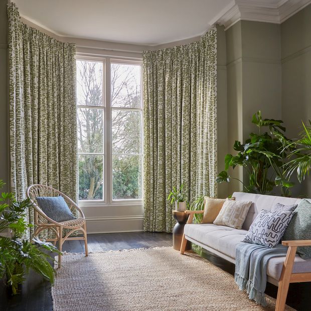 wirl kiwi floor length curtains in greenery filled living room