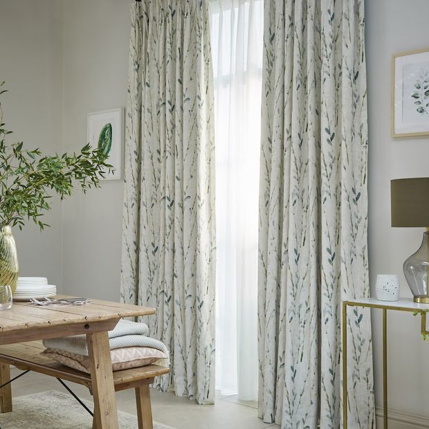 Amerlia mineral floor length sustainable curtains paired with voiles in dining room