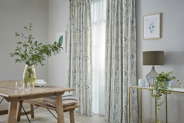 Amerlia mineral floor length sustainable curtains paired with voiles in dining room