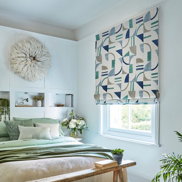 block ocean roman blinds in pastel blue and green themed bedroom