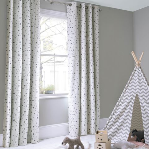 Space mono floor length curtains in childrens playroom