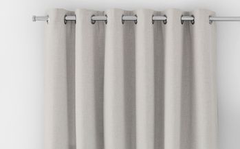 off white curtain header with silver eyelets on a silver curtain pole