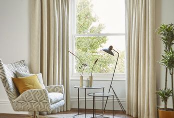 boheme hemp floor length curtains in bay window in cosy bedroom
