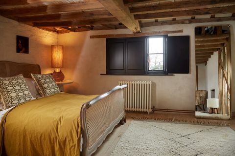 black custom colour solid shutters on bedroom window