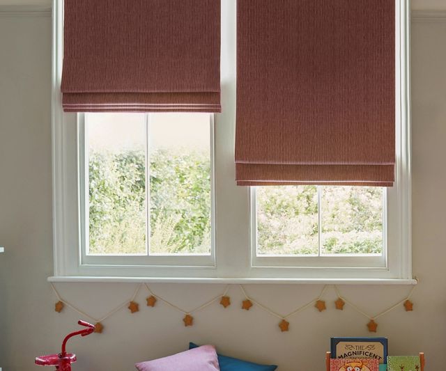 solar fuchsia roman blinds in childrens bedroom