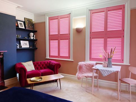 Pink custom colour tier on tier shutters in pink living room