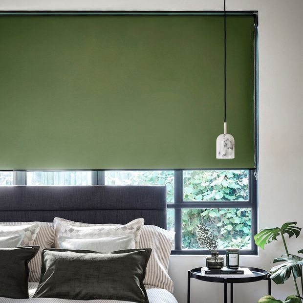 cordova pesto green blackout roller blinds in bedroom
