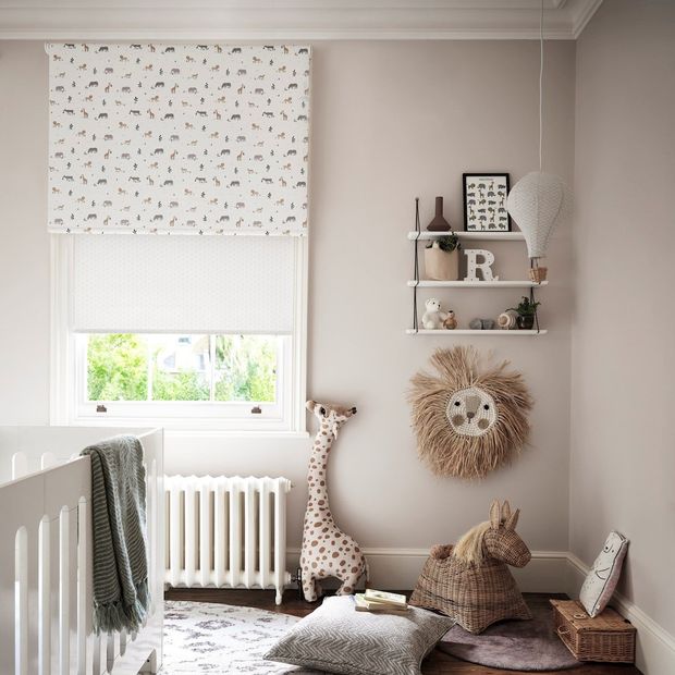 safari jungle roller blind paired with white roller blind in childrens bedroom