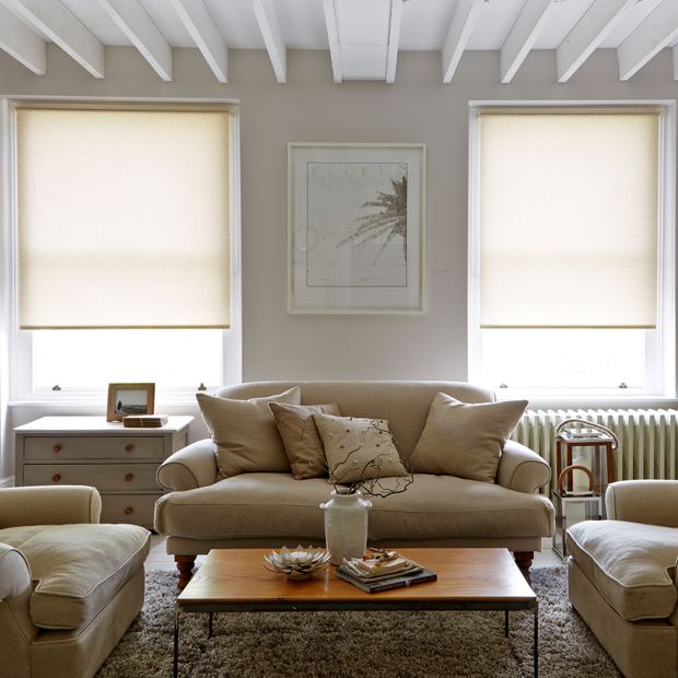 Pair of Lopez malt beige roller blinds in beige living room