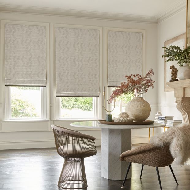 three cadillac fossil roman blinds on three windows in dining room