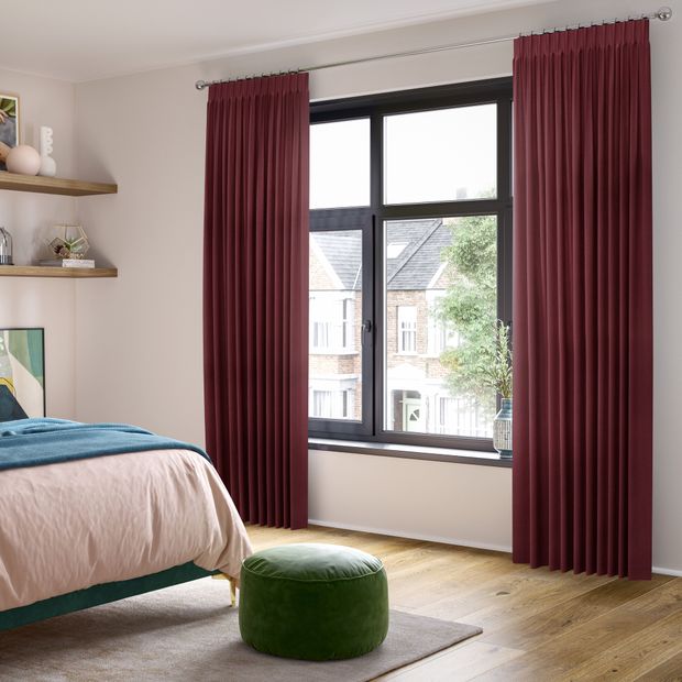 conal plum floor length pinch pleat curtains in cosy pastel bedroom