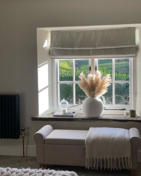 Surface Silver Roman blinds in cosy living room