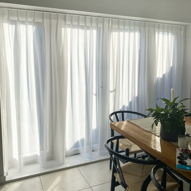astro cream floor length curtains on patio doors in dining room