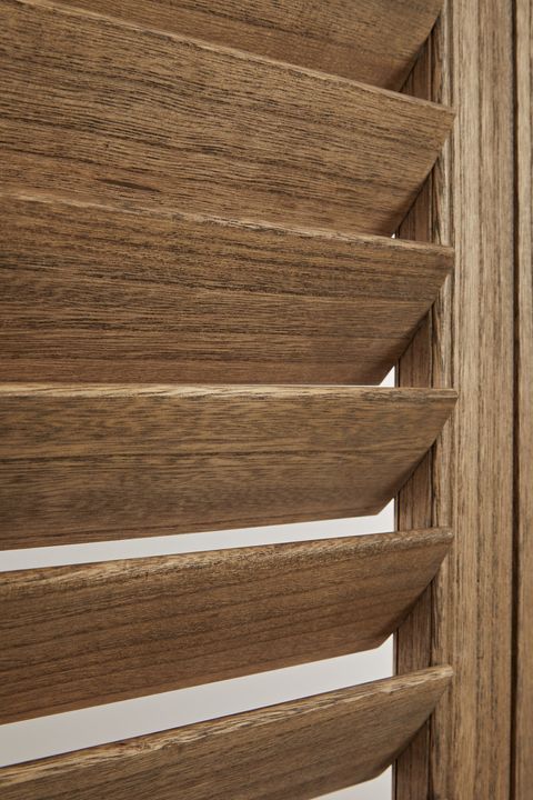 Close up of wooden grain of antique oak shutters 