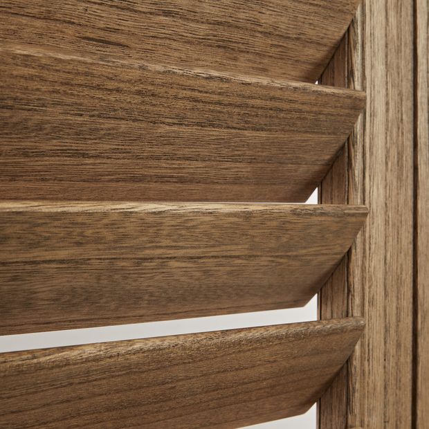 Close up of wooden grain of antique oak shutters 