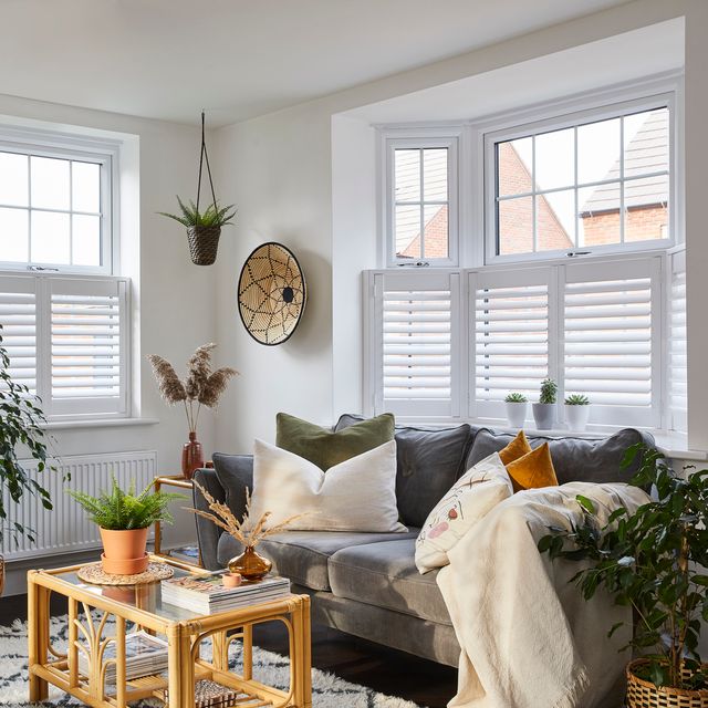 pure white cafe shutters on living room windows