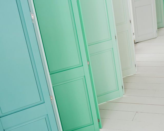 pale green, blue and white solid shutters in kitchen