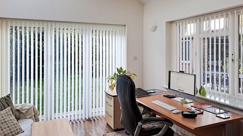 office conservatory white with vertical blinds over the patio doors