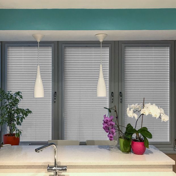 silver fully closed perfect fit pleated blinds on kitchen windows