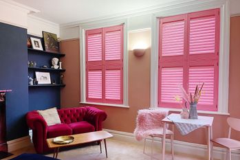 tier on tier barbie pink closed shutters in elegant pink themed living room