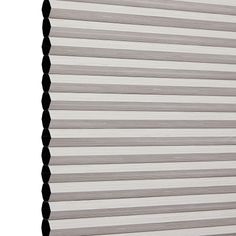 Stone Thermashade swatch is a mid-to-light grey shad- image has an angle view, showing the side of the pleated blind