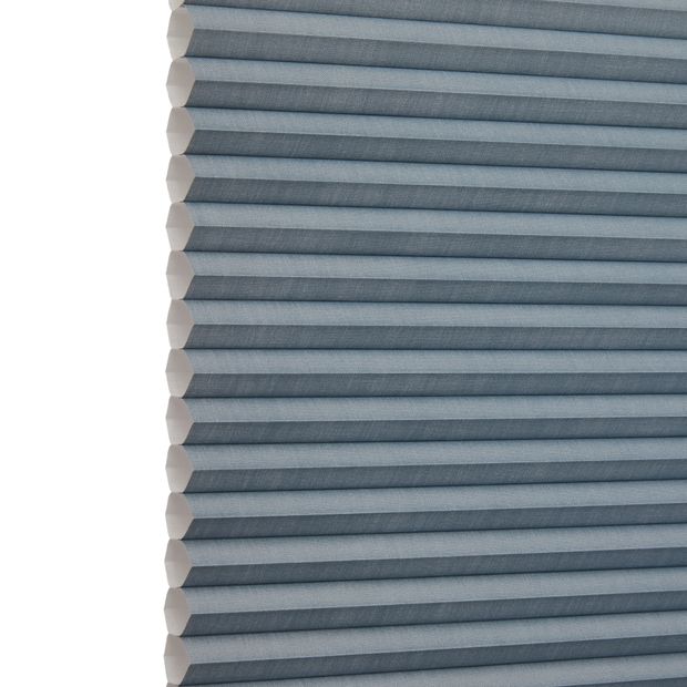 Silk Blue Grey Duette swatch is a smoky blue shade- image has an angle view, showing the side of the pleated blind