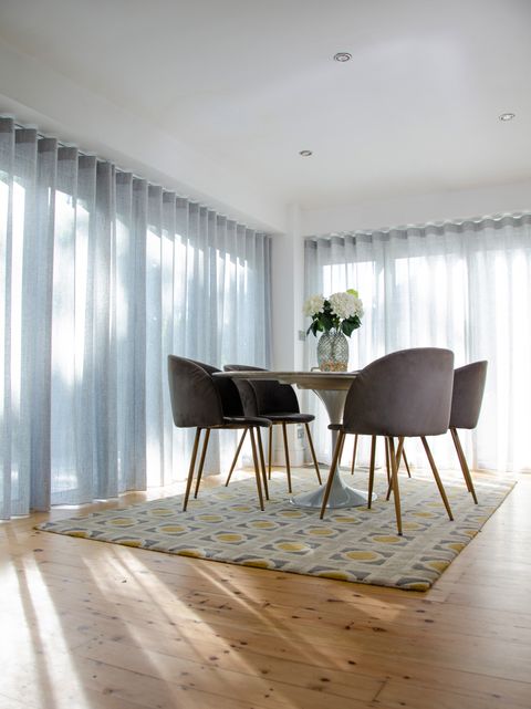 fully closed sheer silver voiles on bifold doors with intu pleated blinds in dining room