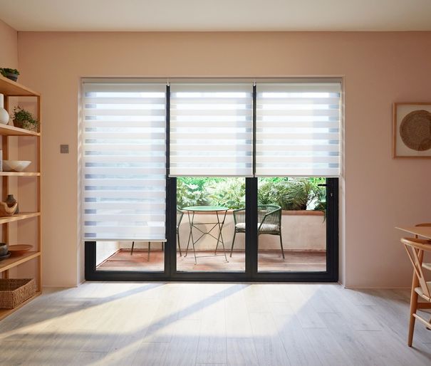 white day and night blinds on sliding patio doors in dining room area