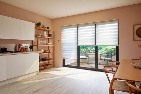 white day and night blinds on sliding patio doors in dining and kitchen area