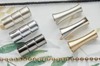 array of decorative pulls used to open and close roller blinds