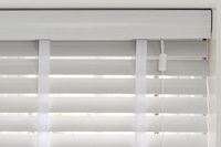 white wooden blinds with matching white valance