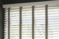 white wooden blinds with dark grey coloured tapes