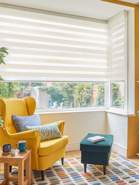 cream day and night blinds on box bay window in living room