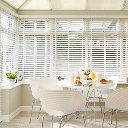 Matte White Wood Illusion Blind in Conservatory with Dining Table and Chairs