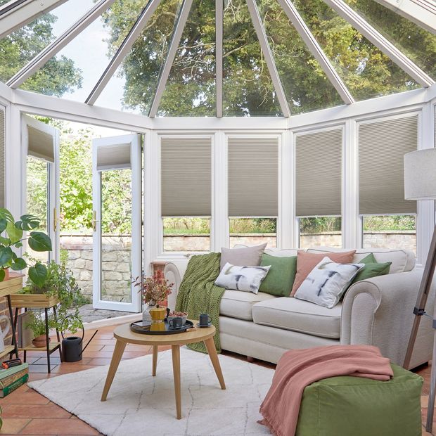 grey duette pleated blinds on windows in circular conservatory
