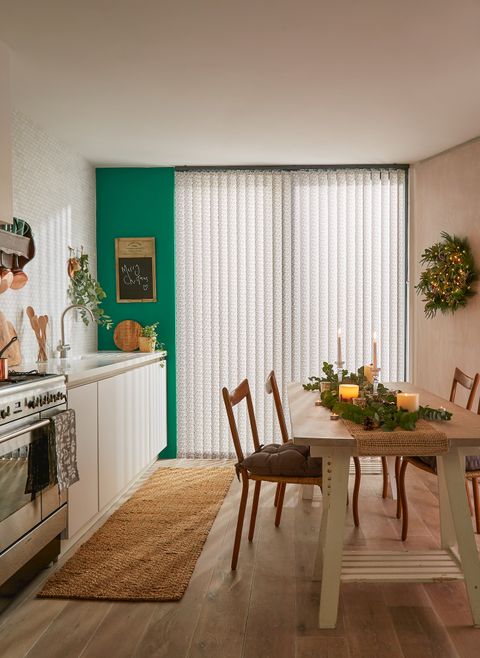 cream patterned vertical blinds on tall kitchen patio doors with christmas decorations